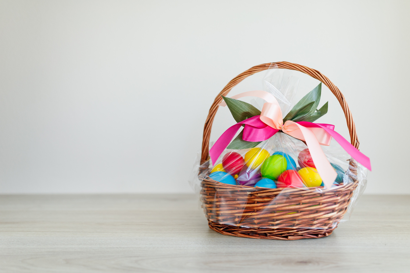 Easter color eggs in festive gift basket